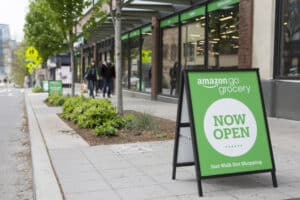 The Versatility and Importance of Sandwich Boards in Retail Marketing - shown with an Amazon Go Grocery board